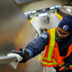 An MTA worker disinfects a subway station in the Manhattan